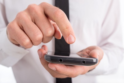 Close Up of Man Using Touch Screen Smartphone